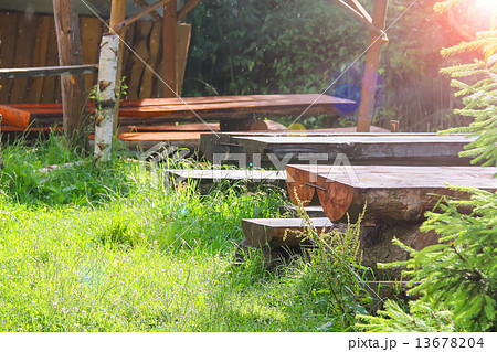 Wooden tables and benches in the gazebo at the park Wooden tables and benches in the gazebo at the park 13678204