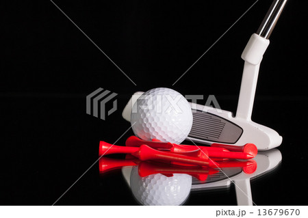 Golf putter and gold equipments on the black glass desk Golf putter and gold equipments on the black glass desk 13679670