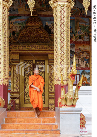 Young Buddhist Monk Walking In Front Of Monastery 13679706