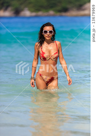 woman going for a swim in Thailand waters woman going for a swim in Thailand waters 13679969
