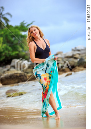 Blonde Woman Posing at the beach Blonde Woman Posing at the beach 13680135