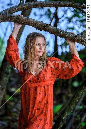 Blonde Woman in Red Wet Dress at rainig day 13680175