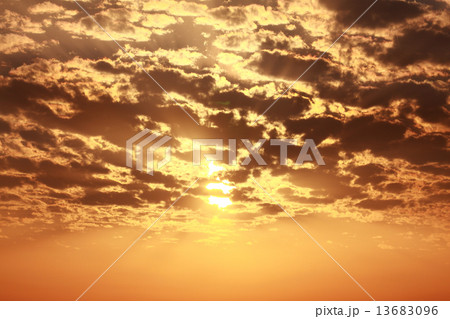 Sun behind cloud orange warm sky Sun behind cloud orange warm sky 13683096