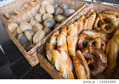 Basket filling with delicious bread and pretzel Basket filling with delicious bread and pretzel 13683889