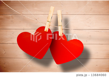 Composite image of hearts hanging on line Composite image of hearts hanging on line 13684060