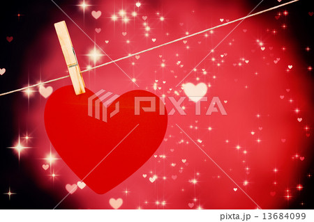 Composite image of heart hanging on line 13684099