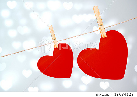 Composite image of hearts hanging on a line 13684128