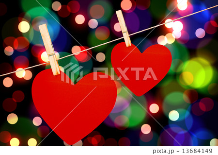 Composite image of hearts hanging on a line 13684149
