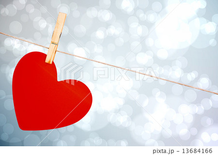 Composite image of heart hanging on line Composite image of heart hanging on line 13684166