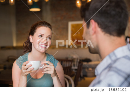 Young couple having coffee together 13685102