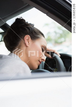 Woman sleeping on the wheel Woman sleeping on the wheel 13685836