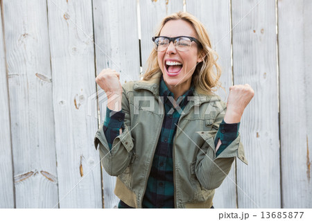 Blonde in glasses shouting and cheering Blonde in glasses shouting and cheering 13685877