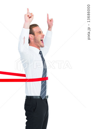 Happy businessman crossing the finish line and pointing up Happy businessman crossing the finish line and pointing up 13686000