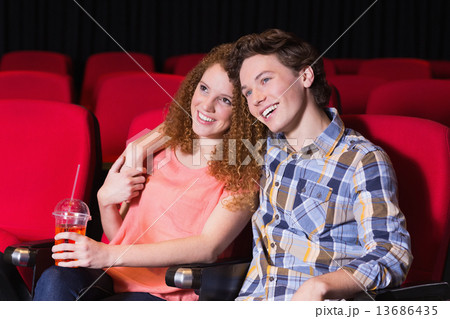 Young couple watching a film Young couple watching a film 13686435