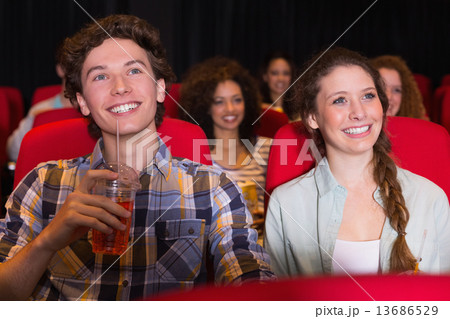 Young couple watching a film Young couple watching a film 13686529