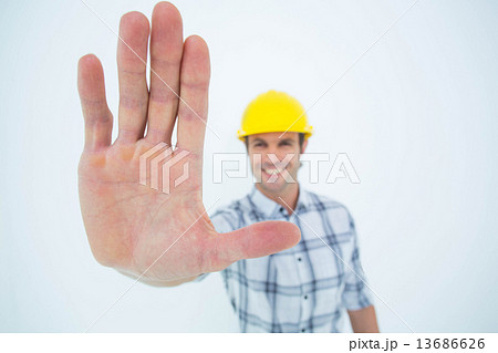 Carpenter showing palm over white background Carpenter showing palm over white background 13686626