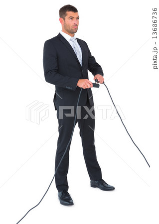 Businessman connecting a plug 13686736