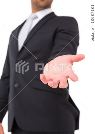 Businessman holding out his hand 13687131