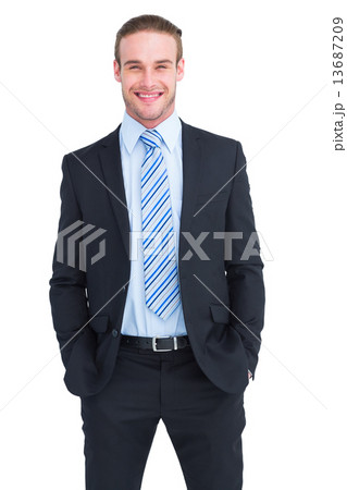 Smiling elegant businessman with hands in pockets Smiling elegant businessman with hands in pockets 13687209
