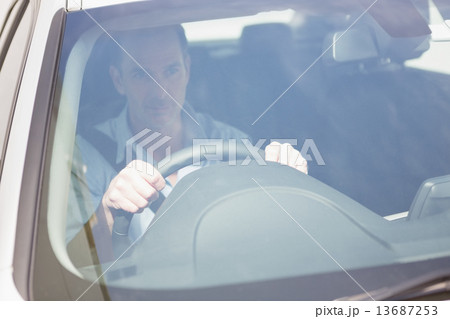 Focused man sitting at the wheel Focused man sitting at the wheel 13687253