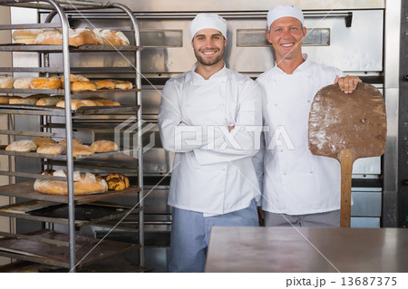 Team of bakers smiling at camera 13687375