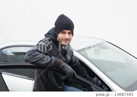 Car thief looking at camera Car thief looking at camera 13687385
