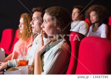 Young friends watching a film 13687590