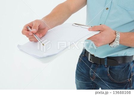Delivery man with clipboard asking for signature 13688108