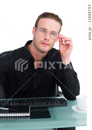 Thoughtful businessman working at his desk 13688704
