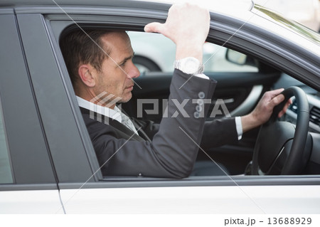 Focused businessman in the drivers seat Focused businessman in the drivers seat 13688929