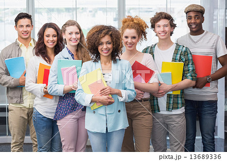 Fashion students smiling at camera together 13689336