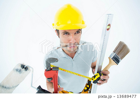Carpenter with various equipment Carpenter with various equipment 13689477