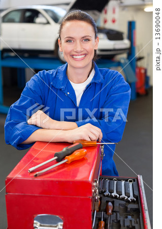 Mechanic smiling at the camera 13690048