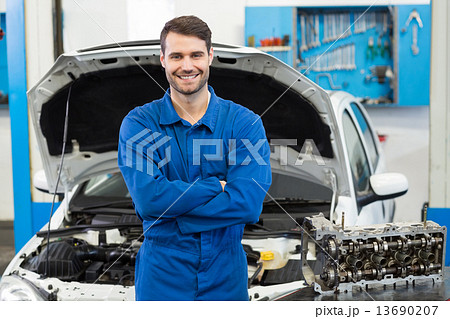 Smiling mechanic looking at camera Smiling mechanic looking at camera 13690207