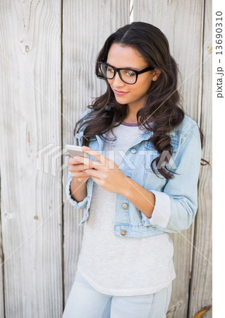 Pretty hipster sending a text 13690310
