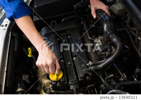 Mechanic working under the hood Mechanic working under the hood 13690321