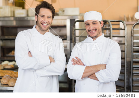 Smiling bakers looking at camera Smiling bakers looking at camera 13690481