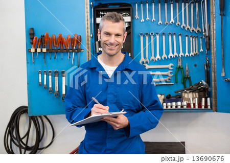 Smiling mechanic looking at camera 13690676