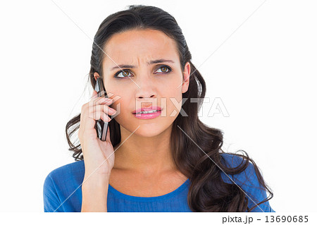 Pretty brunette talking on the phone 13690685