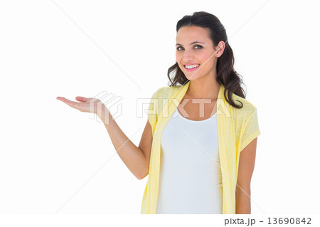 Pretty brunette smiling at camera 13690842