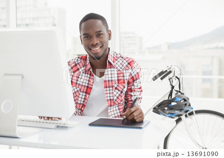 Casual businessman using digitizer and computer 13691090