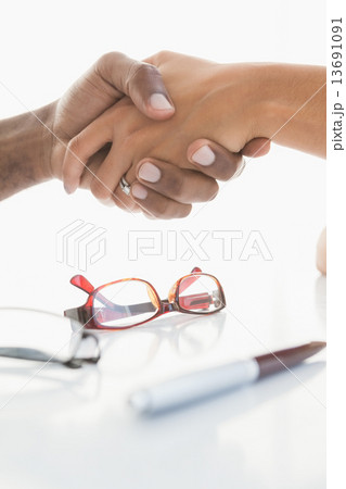 Handshake to seal a deal after a business meeting 13691091