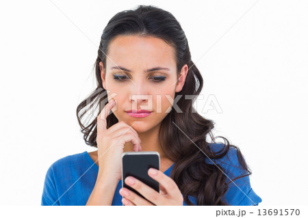 Pretty brunette sending a text Pretty brunette sending a text 13691570