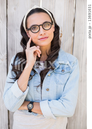 Pretty hipster thinking and smiling Pretty hipster thinking and smiling 13691631