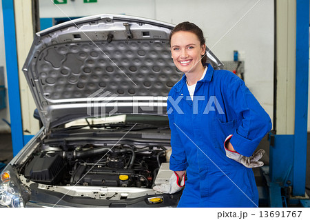 Mechanic smiling at the camera 13691767