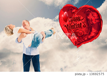Composite image of mature man carrying his laughing partner Composite image of mature man carrying his laughing partner 13692575