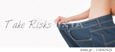 Close up of a woman belly in too big pants Close up of a woman belly in too big pants 13692920