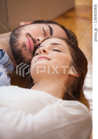 Cute couple sleeping on the floor Cute couple sleeping on the floor 13693068