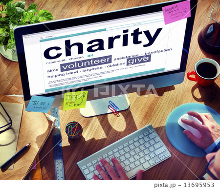 Man Reading the Definition of Charity 13695953