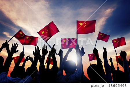 Silhouettes of People Holding the Flag of China 13696443